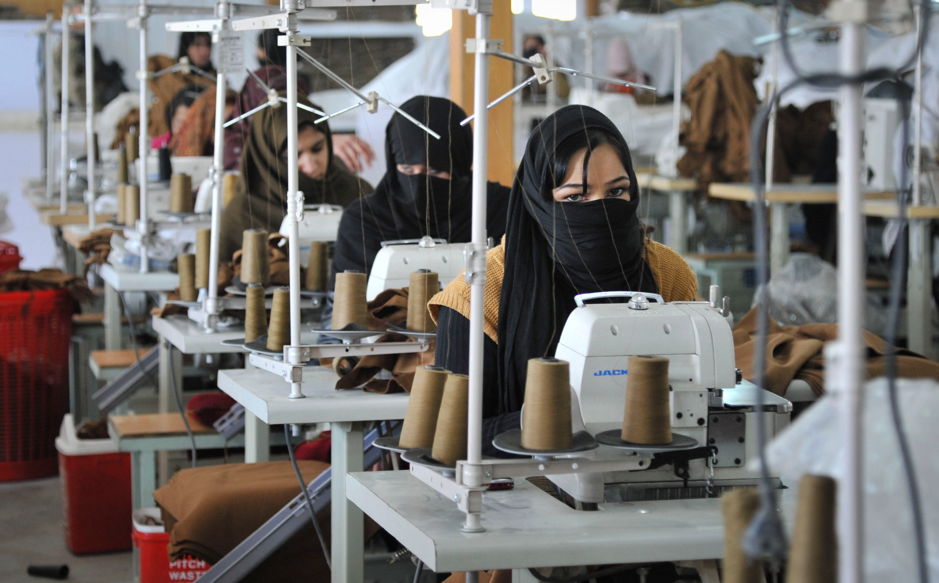 Afghan women sewing at a textile factory in Kabul in 2012